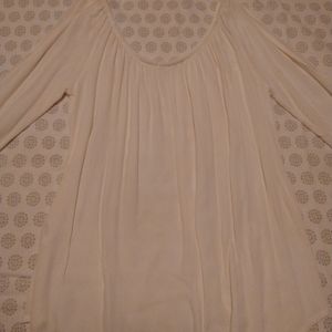 Beautiful cream colored blouse size small.